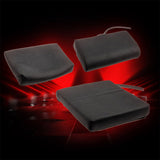 Three black rectangular cushions with straps on a red and black background