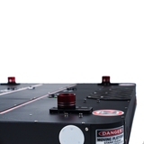 Close-up of a mechanical device with red and black components on a white background